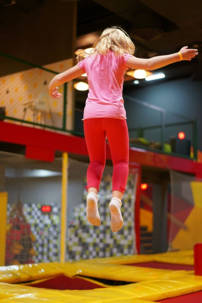 girl jumping trampoline