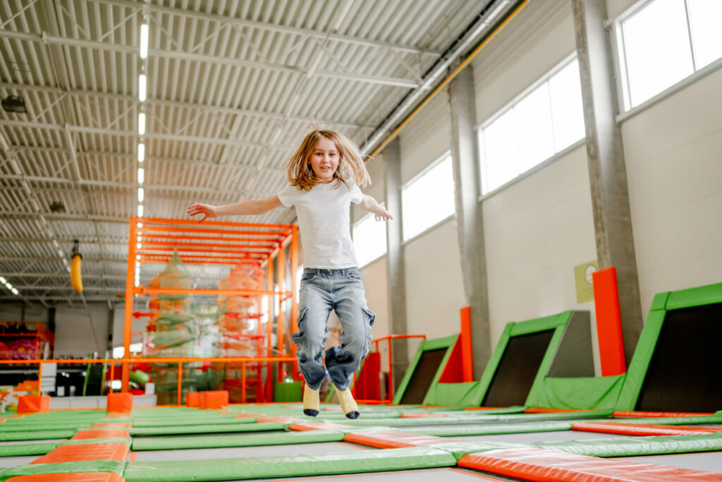pretty girl trampoline park having fun